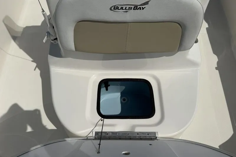 Slide: The Image of 2023 Bulls Bay 2400 boat seat with storage compartment, featuring a sleek design. - 17