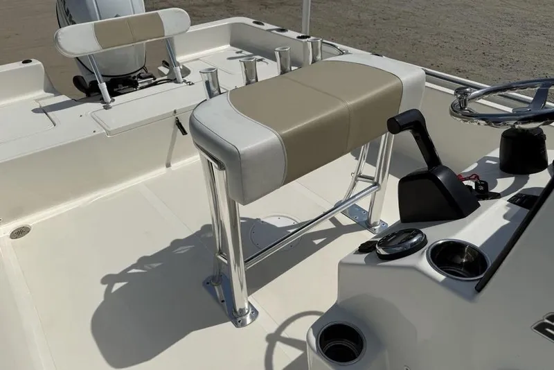 Slide: The Image of 2023 Bulls Bay 2400 boat interior with steering console and seating. - 19