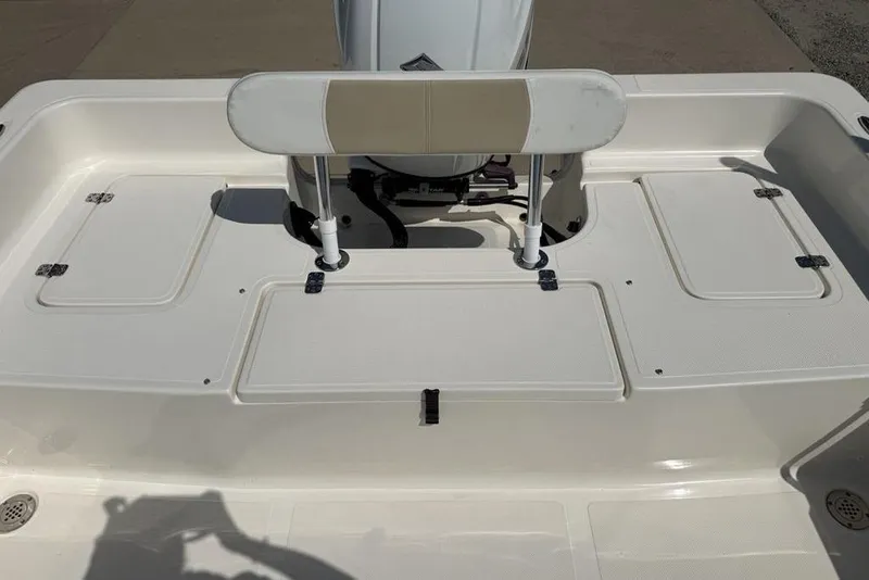 Slide: The Image of 2023 Bulls Bay 2400 boat deck with storage compartments and seating. - 24