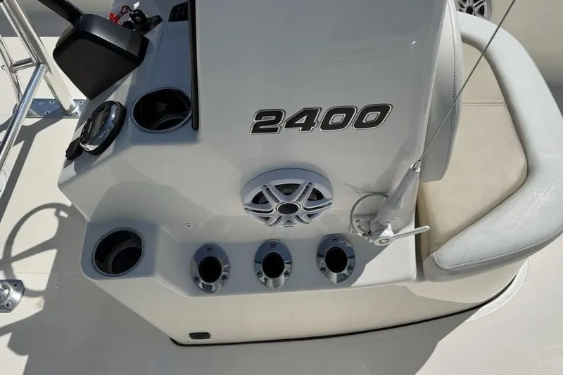Slide: The Image of 2023 Bulls Bay 2400 boat console with cup holders and steering controls. - 26