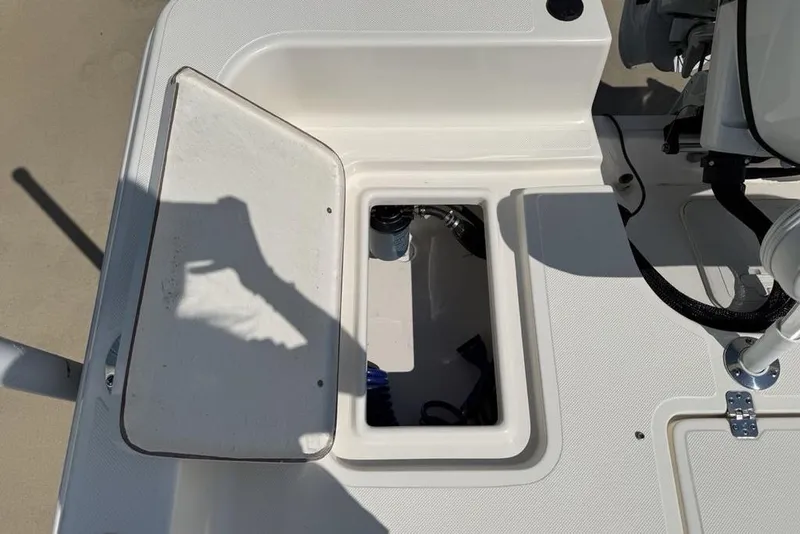 Slide: The Image of Open storage compartment on a 2023 Bulls Bay 2400 boat deck. - 27