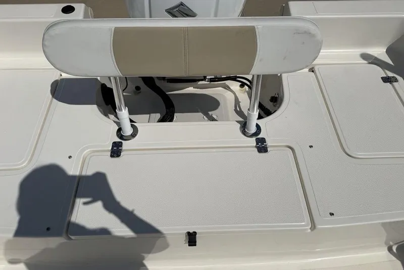 Slide: The Image of 2023 Bulls Bay 2400 boat deck with seating and storage compartments. - 29