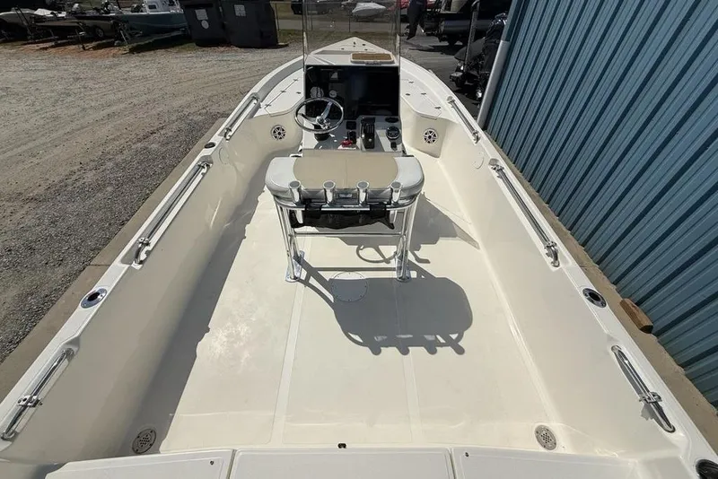 Slide: The Image of 2023 Bulls Bay 2400 boat interior with steering console and seating. - 32
