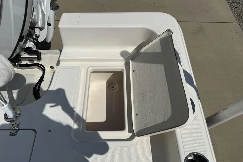 Slide: The Image of 2023 Bulls Bay 2400 boat deck with open storage compartment. - 33