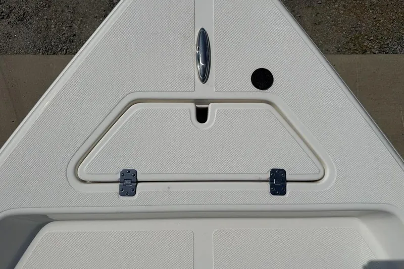 Slide: The Image of Bow storage compartment on a 2023 Bulls Bay 2400 boat, featuring a sleek design and durable hinges. - 5