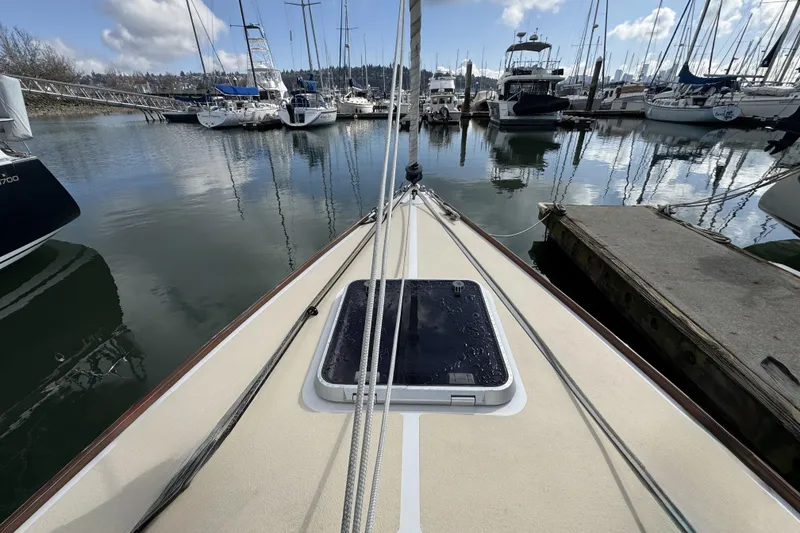 Slide: The Image of Bow view of 2017 Alerion Express 28 sailboat docked in a marina. - 12