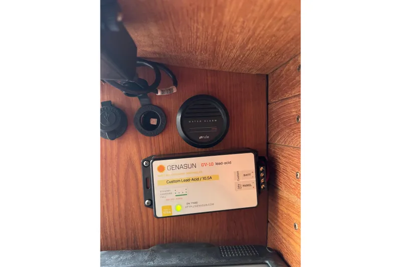 Slide: The Image of Genasun GV-10 solar charge controller in 2017 Alerion Express 28 sailboat interior. - 24