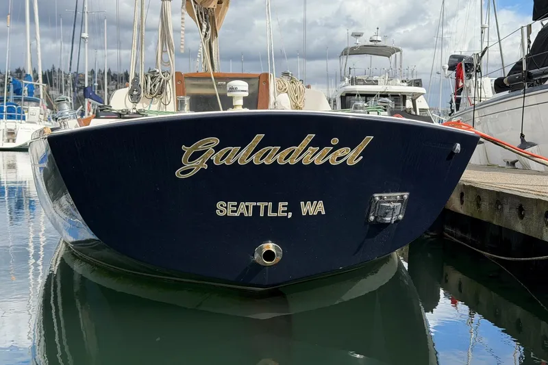 Slide: The Image of Alerion Express 28 sailboat named "Galadriel" docked in Seattle marina, 2017 model. - 4