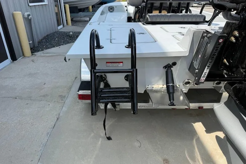 Slide: The Image of Rear view of 2026 SCB S22 boat with ladder and hydraulic components. - 13