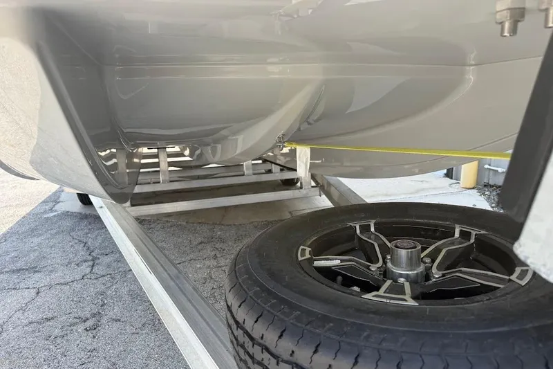 Slide: The Image of Underneath view of 2026 SCB S22 boat on trailer with visible wheel. - 4