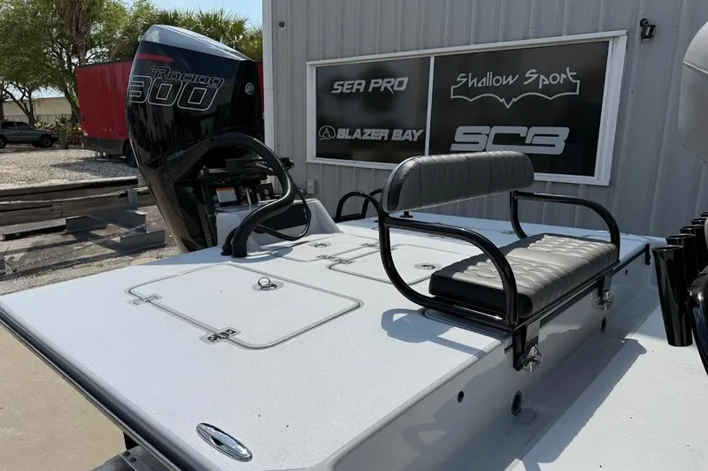 Slide: The Image of 2026 SCB S22 boat with Racing 300 engine, featuring sleek seating and storage compartments. - 7