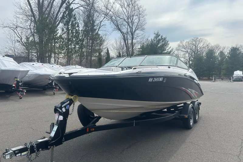 Slide: The Image of 2015 Yamaha Boats SX210 on trailer in outdoor storage area. - 1