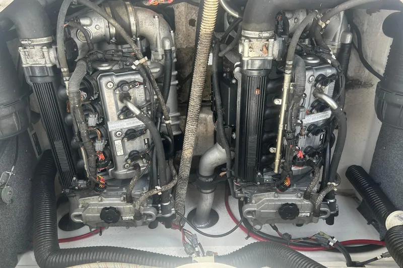 Slide: The Image of 2015 Yamaha Boats SX210 engine compartment with dual engines and wiring. - 9