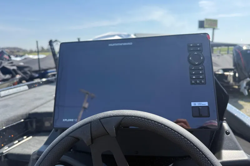 Slide: The Image of Dashboard of a 2026 Skeeter ZXE21 boat featuring a Humminbird Xplore 12 display. - 11