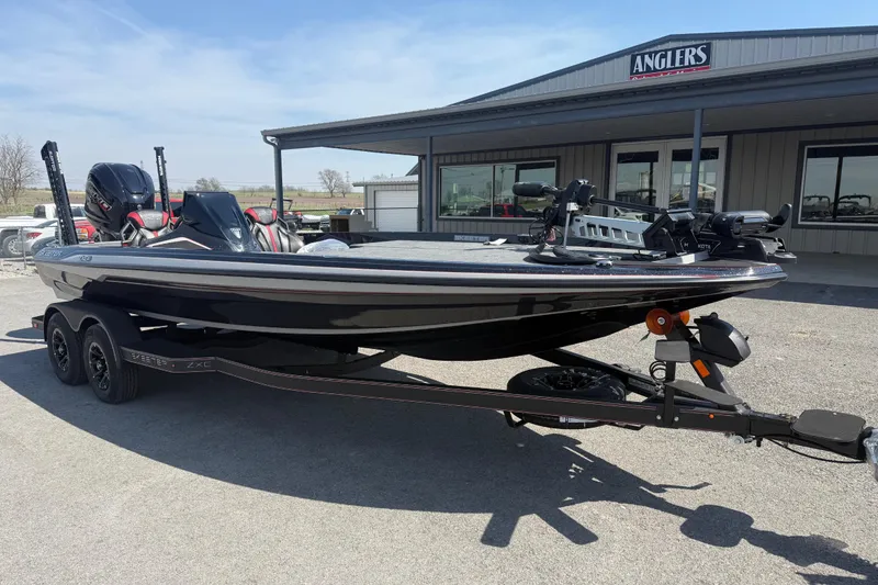 Slide: The Image of 2026 Skeeter ZXE21 boat on trailer outside Anglers store. - 4