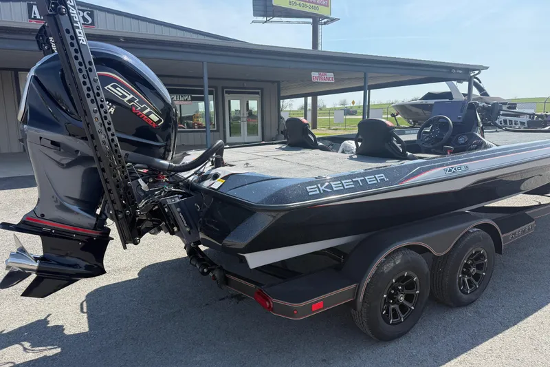 Slide: The Image of 2026 Skeeter ZXE21 boat with powerful engine, parked on a trailer outside a dealership. - 5