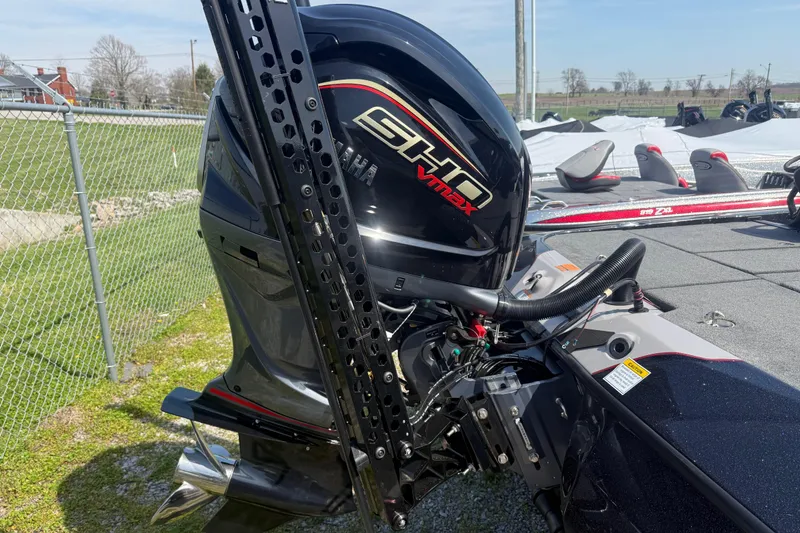 Slide: The Image of 2026 Skeeter ZXE21 boat with Yamaha SHO VMAX engine, parked outdoors. - 8