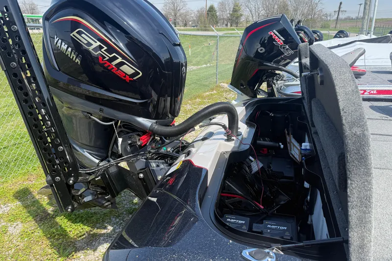 Slide: The Image of 2026 Skeeter ZXE21 boat with Yamaha SHO VMAX engine and open storage compartment. - 9