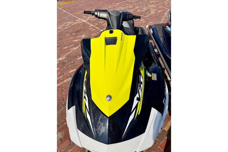 Slide: The Image of 2019 Yamaha WaveRunner VX Deluxe in yellow and black on brick pavement. - 2