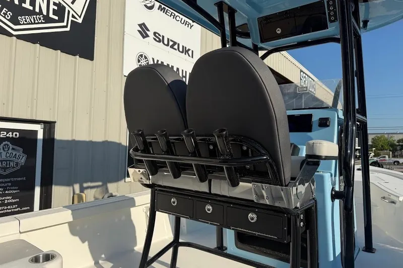 Slide: The Image of 2026 Sea Pro 230 Bay boat interior with dual seats and rod holders. - 10