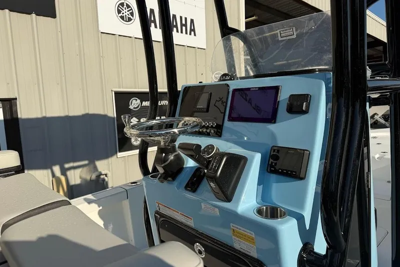 Slide: The Image of 2026 Sea Pro 230 Bay boat console with modern navigation and control systems. - 12