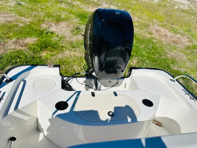 Slide: The Image of 2010 Boston Whaler 150 Montauk boat engine and deck, viewed from above. - 11