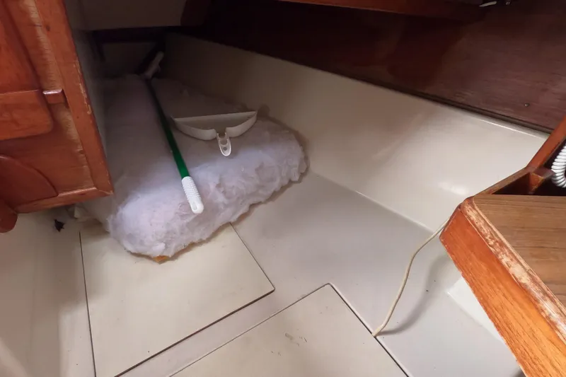 Slide: The Image of Interior of 1982 Irwin 34 Citation sailboat with cleaning supplies. - 10