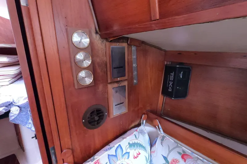 Slide: The Image of Interior of 1982 Irwin 34 Citation sailboat with wooden paneling and control instruments. - 14