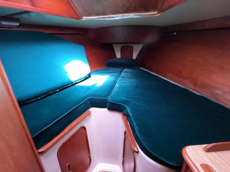 Slide: The Image of Interior of a 1982 Irwin 34 Citation yacht with green upholstery. - 15