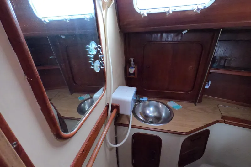 Slide: The Image of Interior of 1982 Irwin 34 Citation sailboat bathroom with sink and mirror. - 20