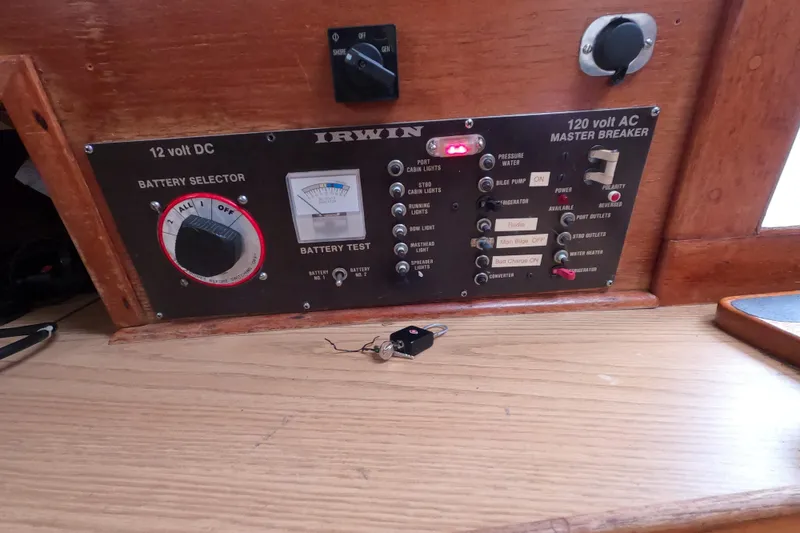 Slide: The Image of Control panel of a 1982 Irwin 34 Citation sailboat with battery selector and master breaker. - 24