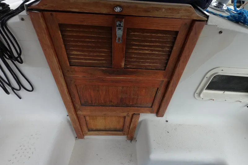 Slide: The Image of Wooden hatch door on 1982 Irwin 34 Citation sailboat deck. - 26