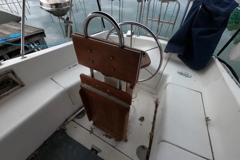 Slide: The Image of Cockpit of 1982 Irwin 34 Citation sailboat with wooden helm and seating. - 28