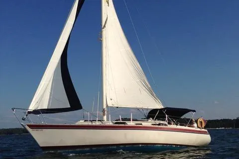 Slide: The Image of 1982 Irwin 34 Citation sailboat on open water. - 4
