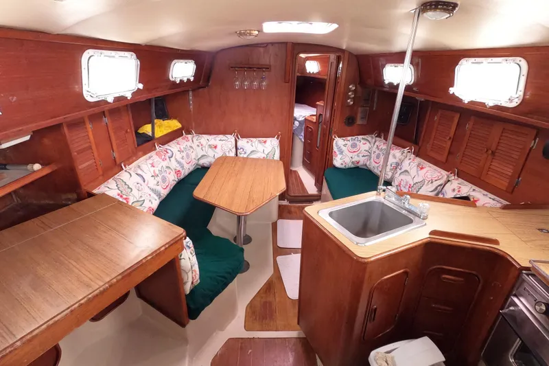 Slide: The Image of Interior of 1982 Irwin 34 Citation sailboat with cozy seating and wooden finishes. - 6