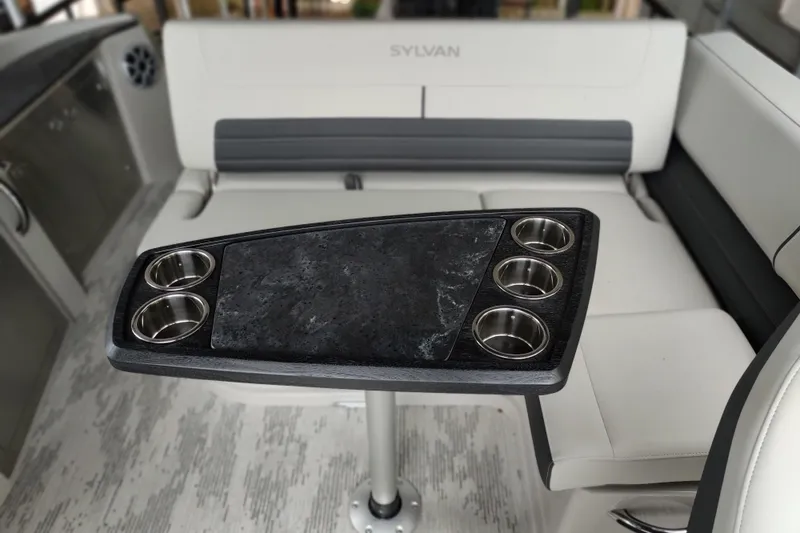 Slide: The Image of Interior of 2026 Sylvan G3 CLZ DH boat with sleek seating and cup holders. - 10