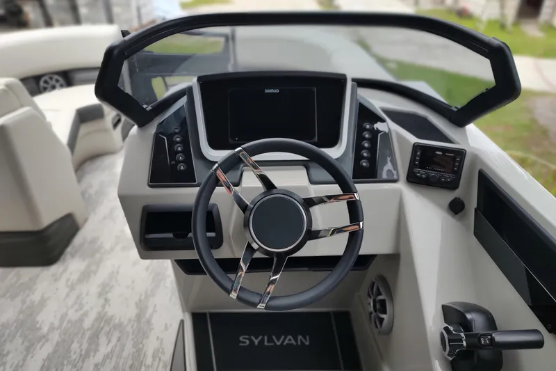 Slide: The Image of Steering console of 2026 Sylvan G3 CLZ DH boat with modern controls and dashboard. - 11