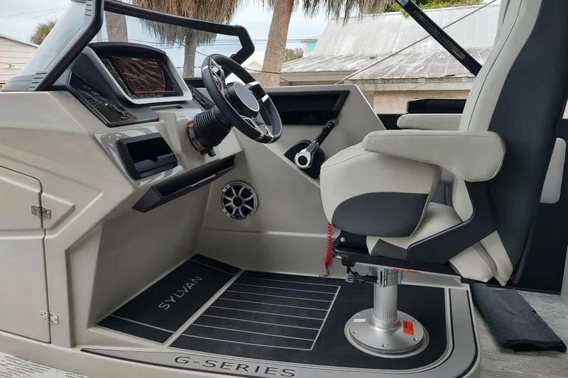 Slide: The Image of Modern helm of 2026 Sylvan G3 CLZ DH boat with steering wheel and controls. - 12