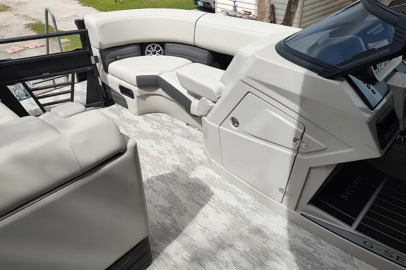Slide: The Image of Interior of 2026 Sylvan G3 CLZ DH boat with modern seating and dashboard. - 14