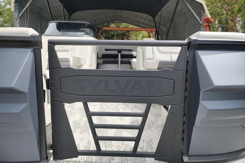 Slide: The Image of 2026 Sylvan G3 CLZ DH boat interior with branded gate and seating. - 15