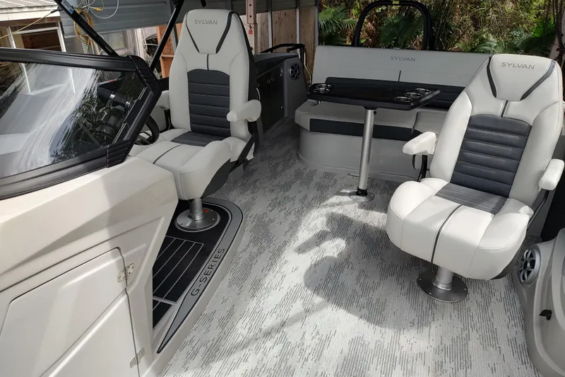 Slide: The Image of Interior of 2026 Sylvan G3 CLZ DH boat with luxurious seating and modern design. - 20