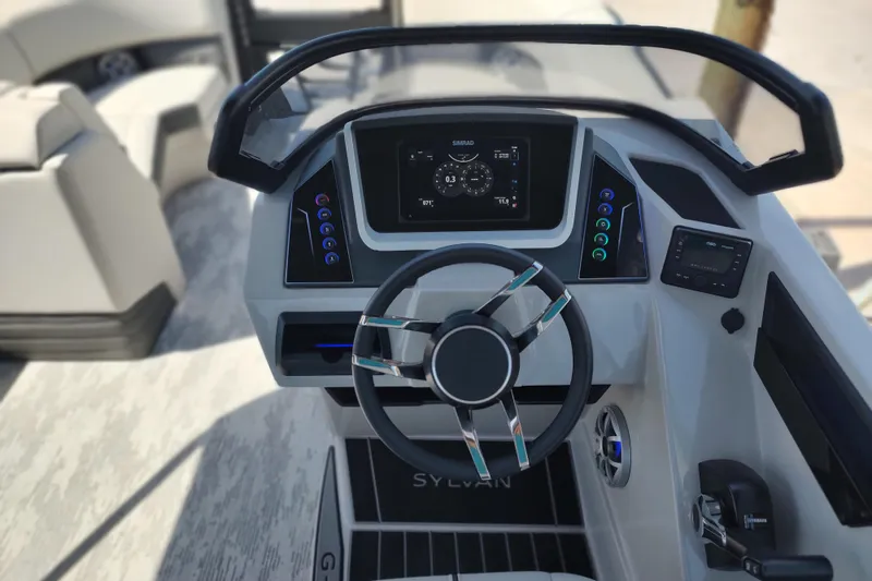 Slide: The Image of Steering console of 2026 Sylvan G3 CLZ DH boat with digital display and controls. - 28