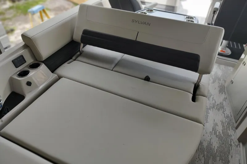 Slide: The Image of 2026 Sylvan G3 CLZ DH boat interior with plush seating and cup holders. - 8