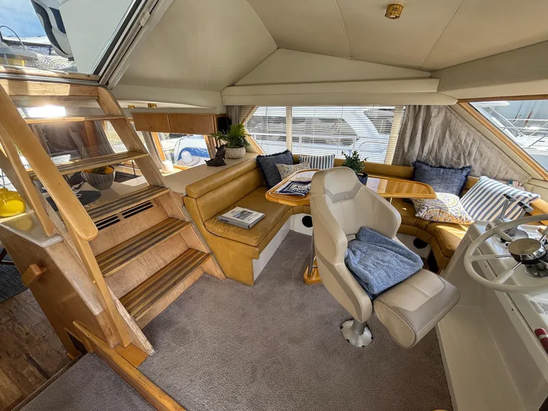 Slide: The Image of Luxurious interior of a 2000 Navigator 5300 yacht with plush seating and elegant decor. - 13