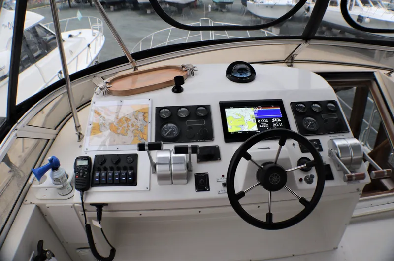 Slide: The Image of Cockpit of 2000 Navigator 5300 yacht with navigation equipment and steering wheel. - 25