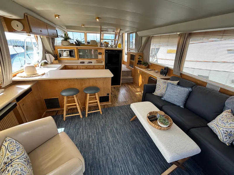 Slide: The Image of Luxurious interior of a 2000 Navigator 5300 yacht with modern furnishings and kitchen area. - 7