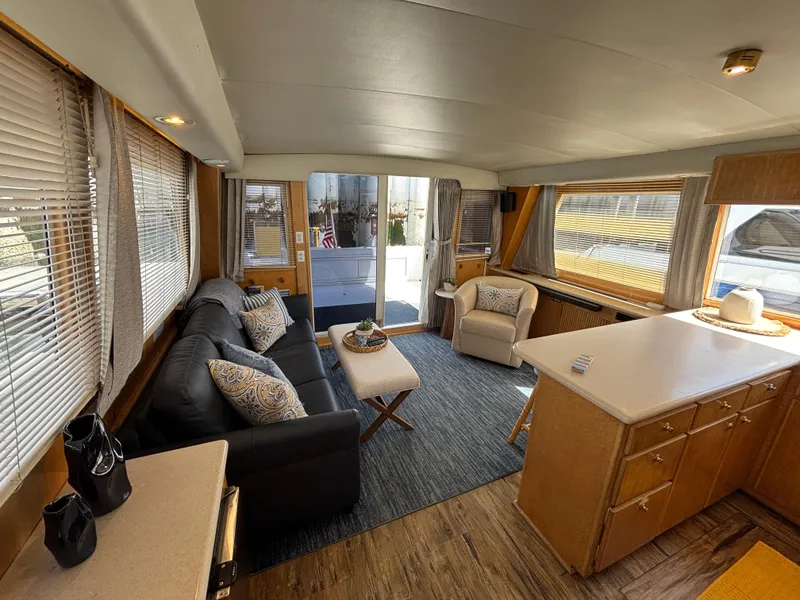 Slide: The Image of Interior of 2000 Navigator 5300 yacht with cozy seating and modern kitchen area. - 9