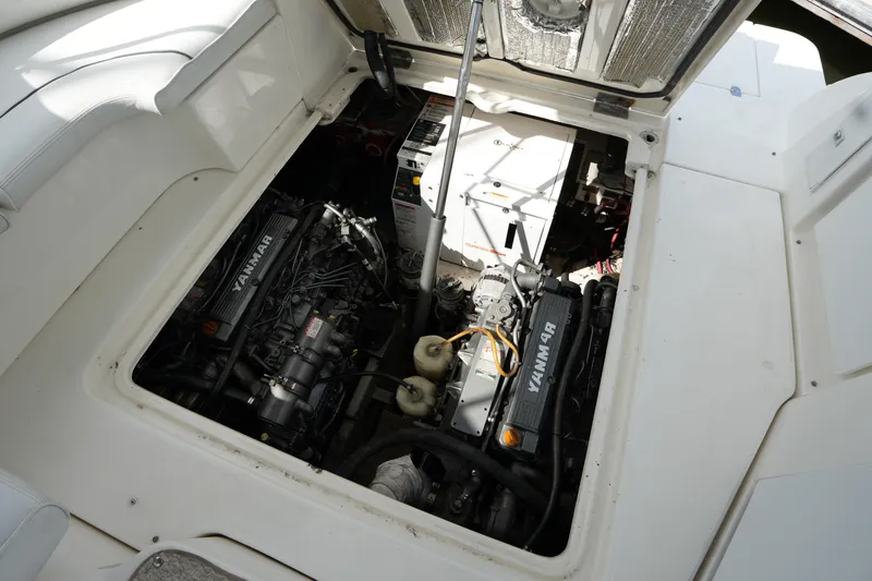 Slide: The Image of Engine compartment of 2005 CRUISERS YACHT 340 Express with Yanmar engines visible. - 27