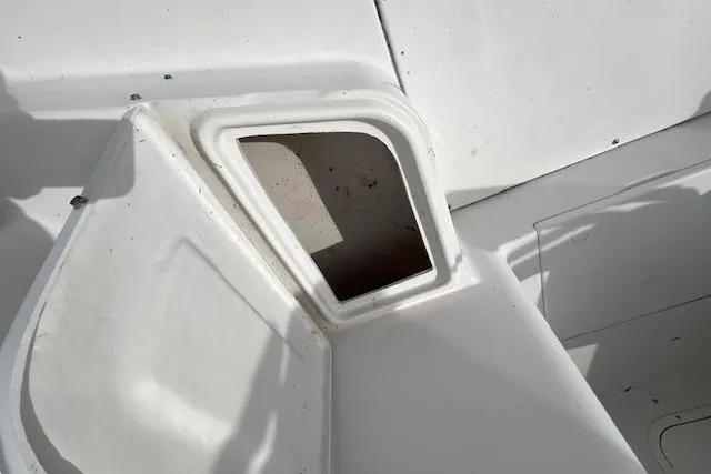 Slide: The Image of 2006 Striper 2301 Walkaround OB boat compartment detail, showing open storage area. - 12