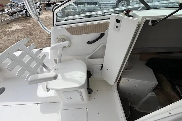 Slide: The Image of 2006 Striper 2301 Walkaround OB boat interior with seating and cabin entrance. - 15